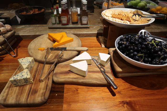 a table with cheese and grapes