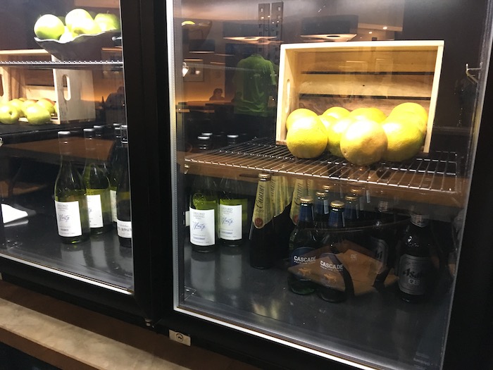a shelf with bottles and lemons