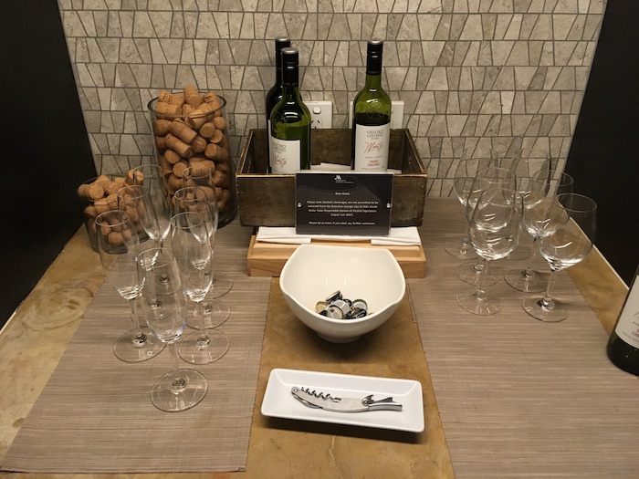 a table with wine glasses and bottles