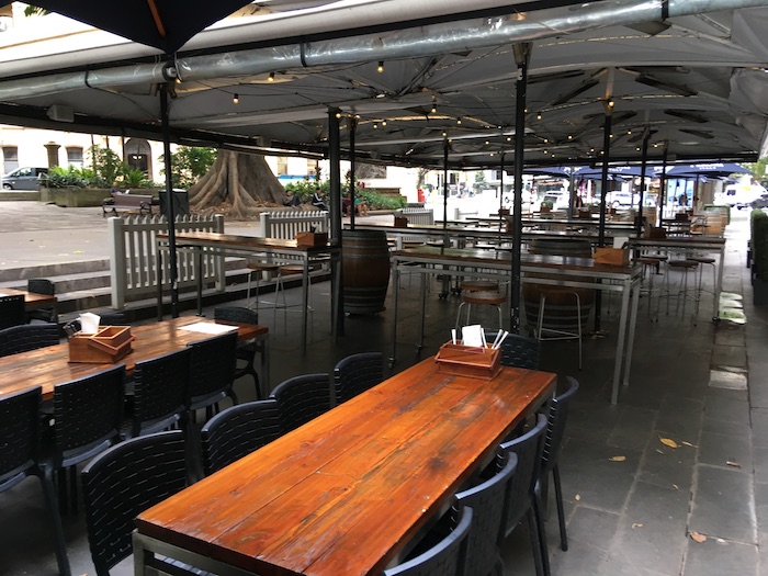 tables and chairs under a canopy