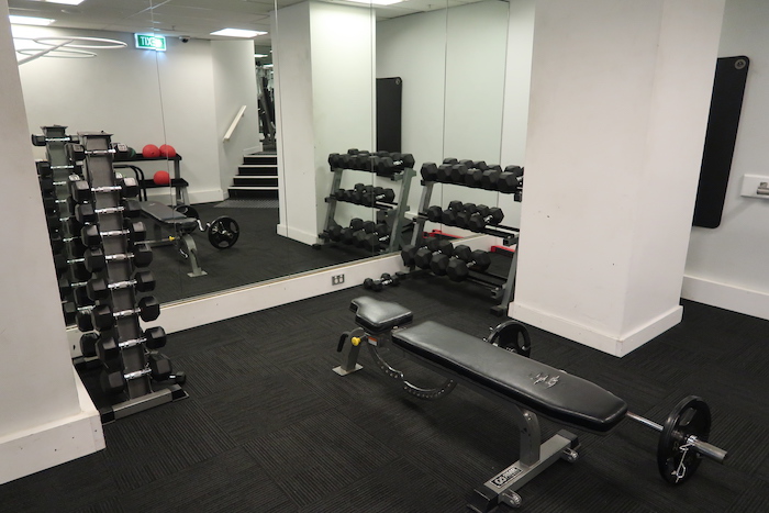 a gym with weights in the room