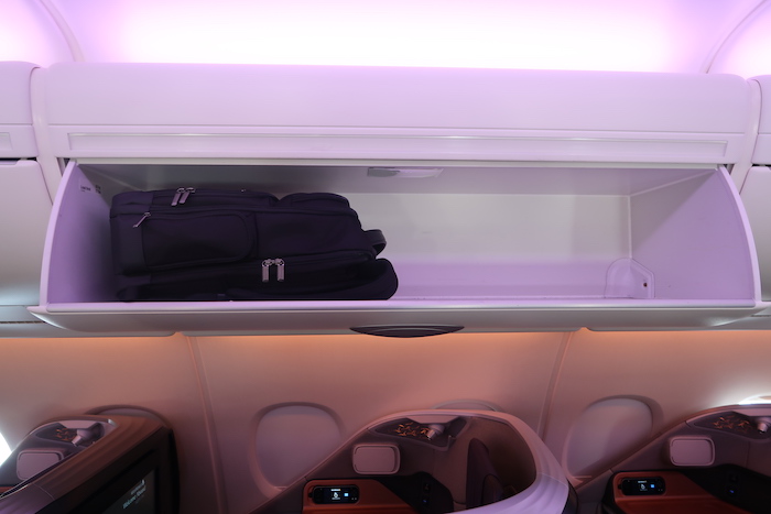 a shelf with luggage on it