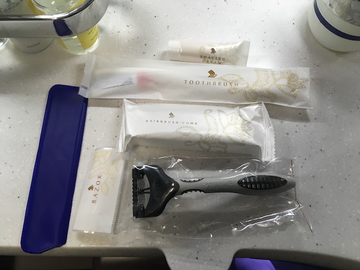 a razor and some packages of toothpaste