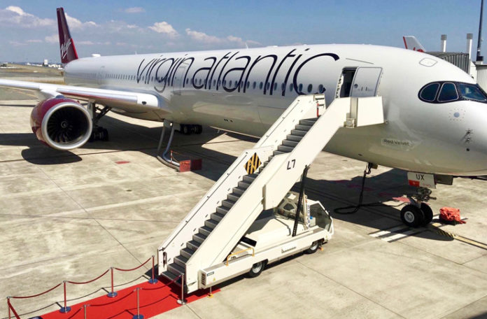 a plane with stairs on the ground