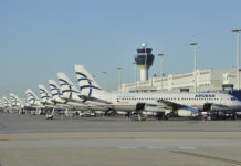 a row of airplanes parked in a row