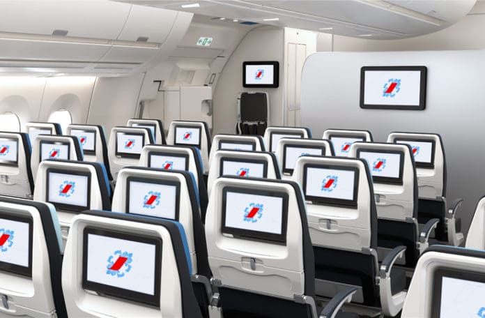 a row of seats with monitors on the side