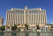 a large building with many windows with Bellagio in the background