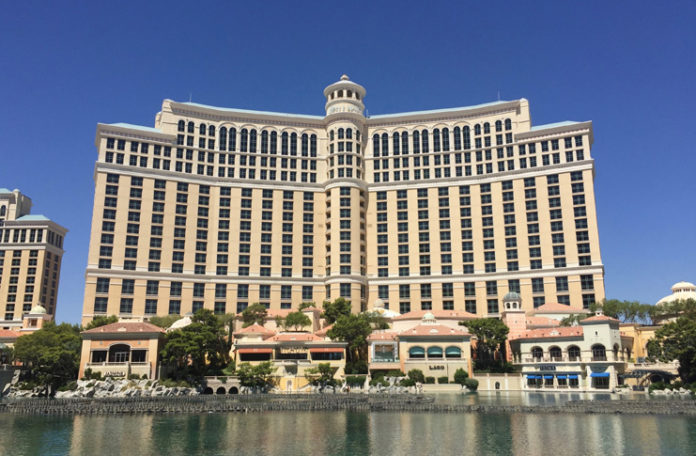 a large building with many windows with Bellagio in the background