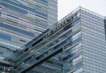 Earn 10,000 bonus Marriott Bonvoy points on select stays in the US and Canada) a building with a sign on it