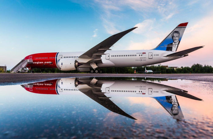 a large airplane on a reflective surface