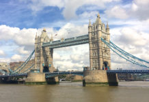 a bridge over water with towers and towers