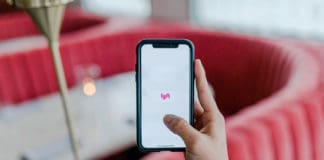 a hand holding a phone