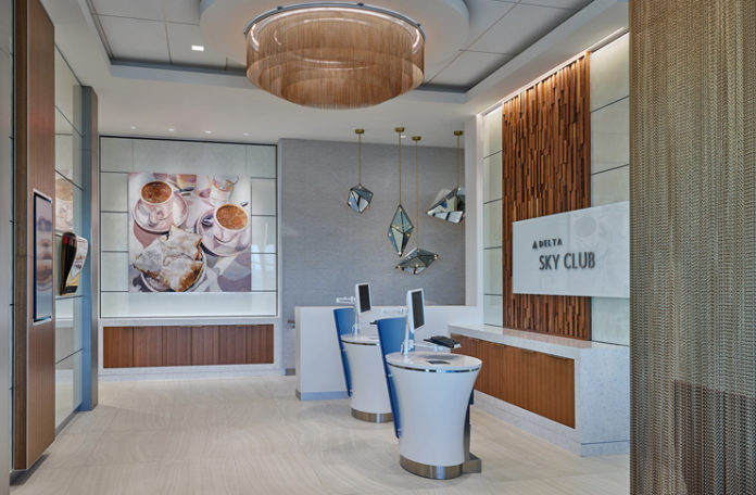 a reception area with a desk and computer