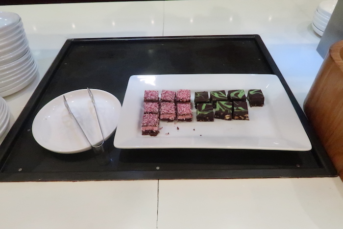 a plate of brownies on a black tray