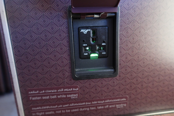 a black outlet with green lights