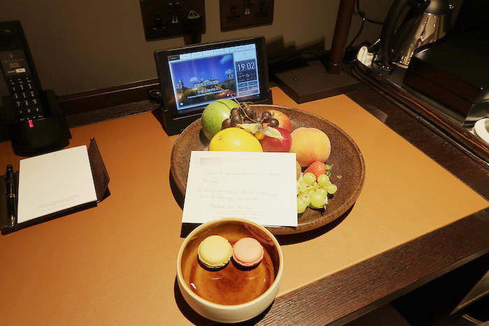 a bowl of fruit and a bowl of food on a table