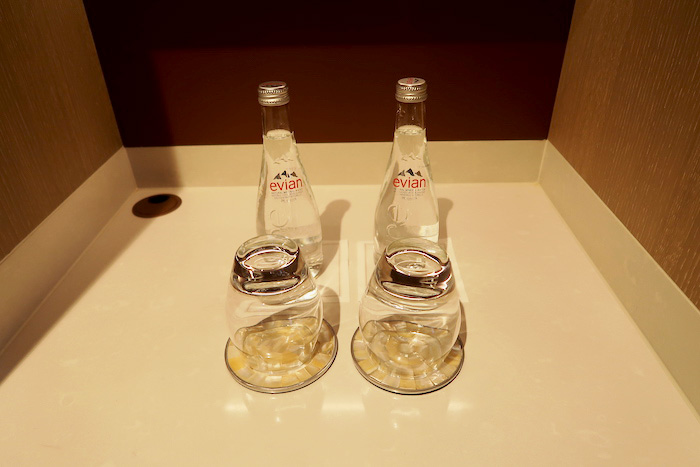 a group of clear bottles on a counter