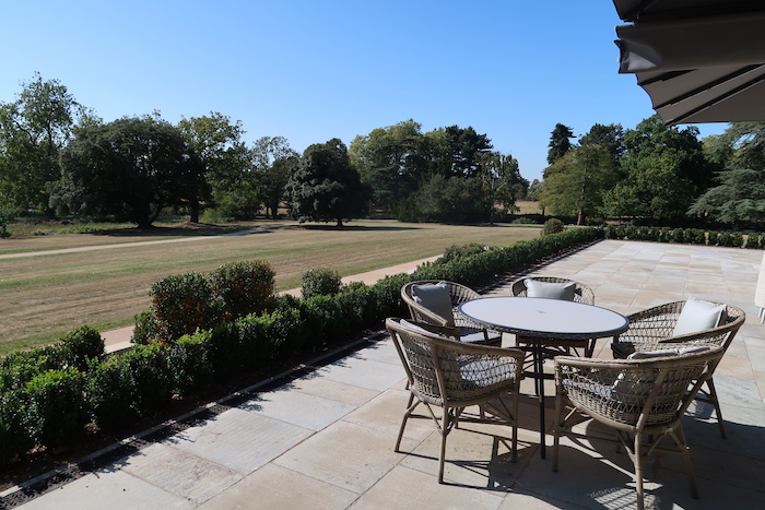 a patio with a table and chairs