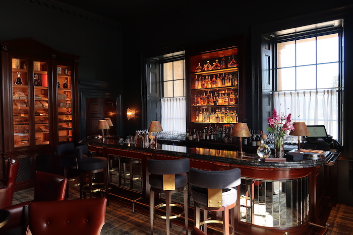 a bar with a shelf of liquor