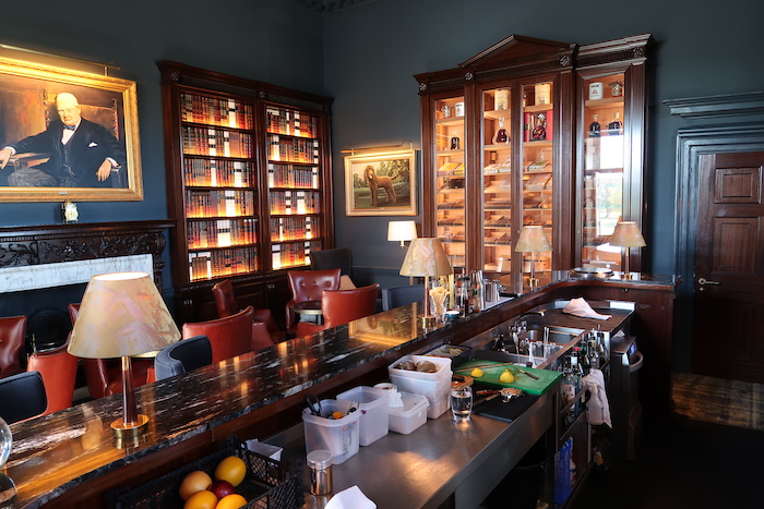 a bar with a black counter and a black marble top