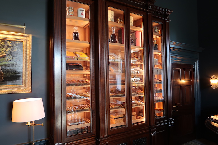 a large wooden cabinet with glass doors