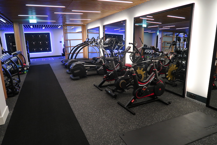 a room with exercise bikes and mirrors