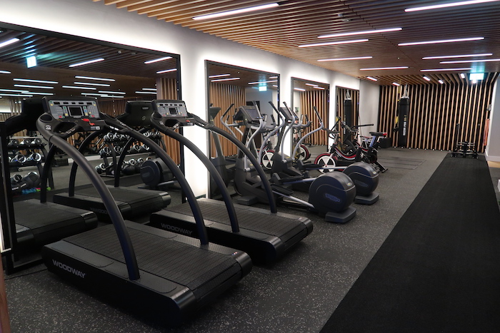 a group of treadmills in a gym