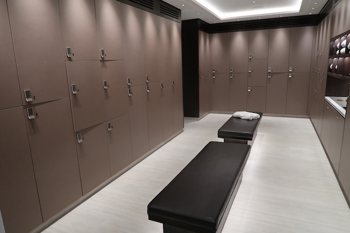 a locker room with a bench and lockers