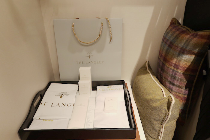 a tray with white boxes and a bag on a table