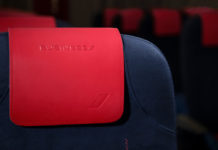 a red and blue seat with a red cover