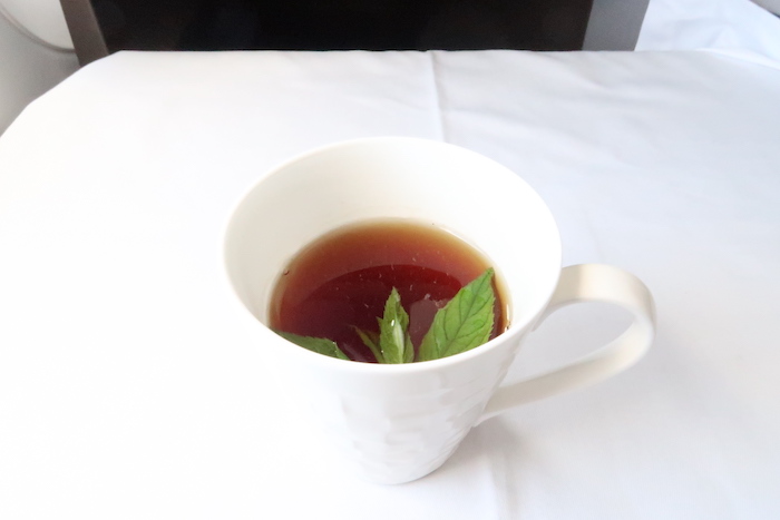 a cup of tea with leaves in it