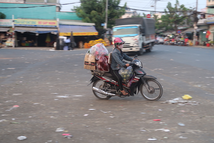 a person on a motorcycle with a lot of bags on it