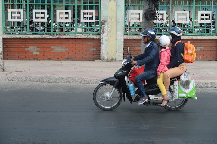 a group of people on a motorcycle