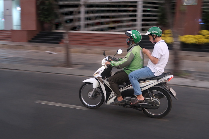 two people riding a motorcycle