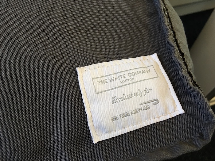 a white label on a grey fabric