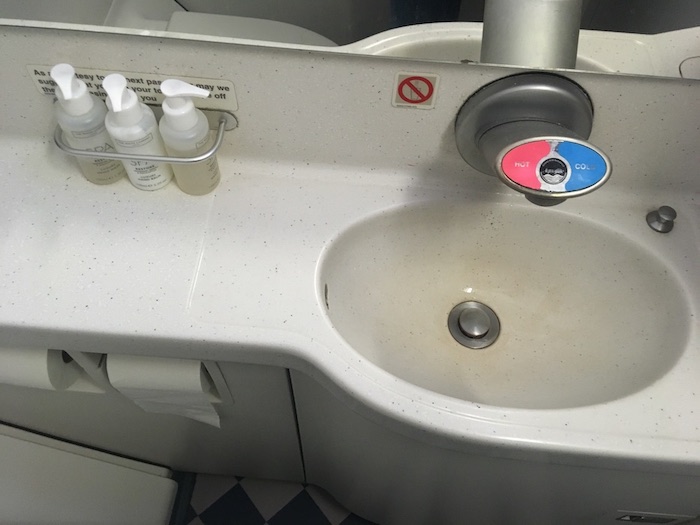 a sink with soap bottles on it