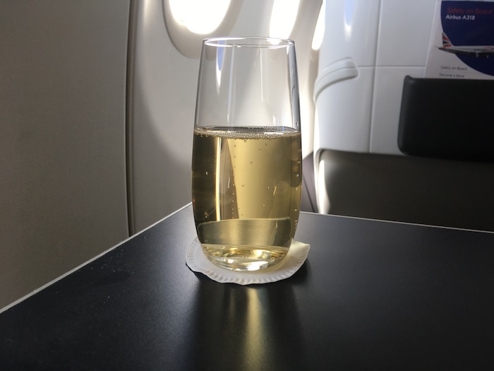 a glass of champagne on a table