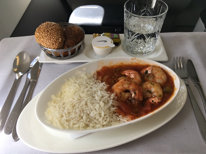 a plate of food with shrimp and rice