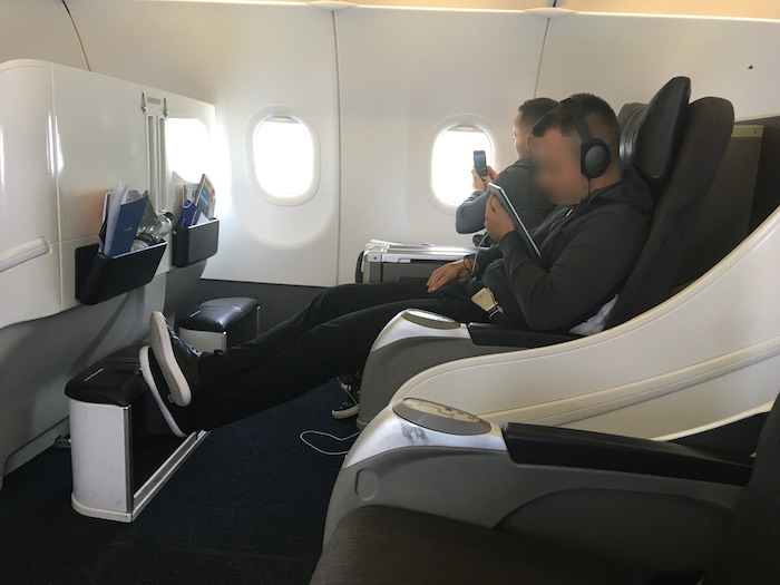 a group of people sitting in a plane