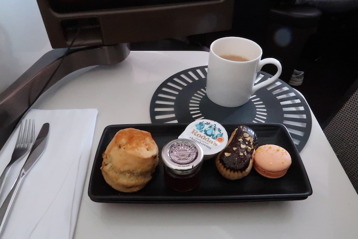a tray of pastries and a cup of coffee