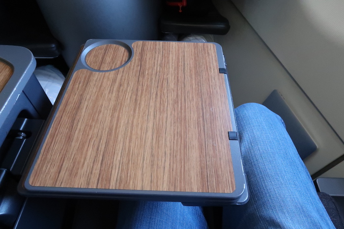 a wooden tablet on a person's lap