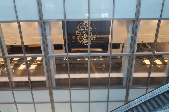a glass wall with a logo on it