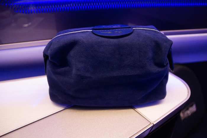 a blue bag on a white surface