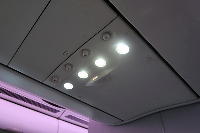 a ceiling with lights and a seat belt