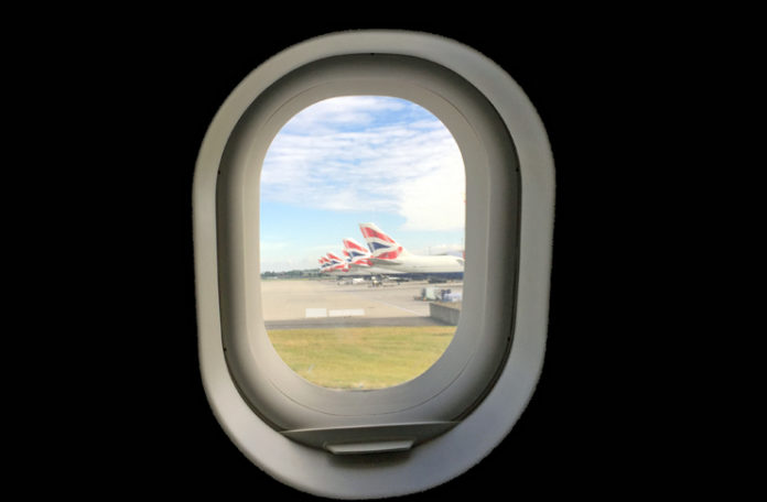 a window with a plane in it