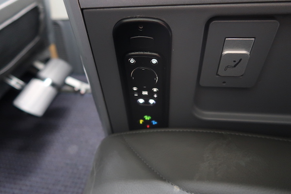 a seat with buttons and lights