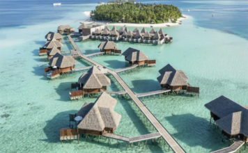 a group of huts on water