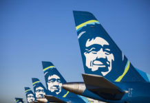 a group of airplanes with faces on the tail