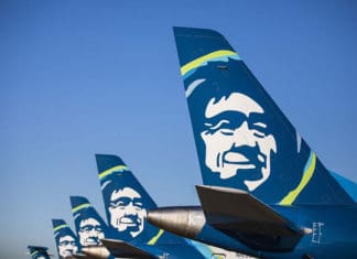 a group of airplanes with faces on the tail