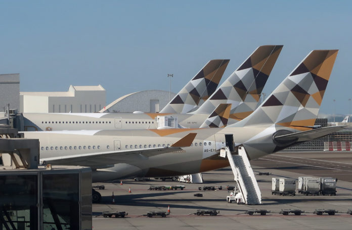 airplanes parked at an airport